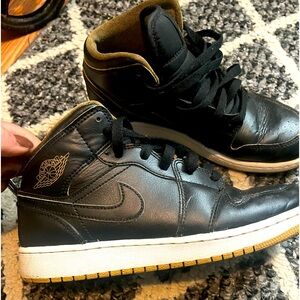 Air Jordan 1s. Black and gold edition